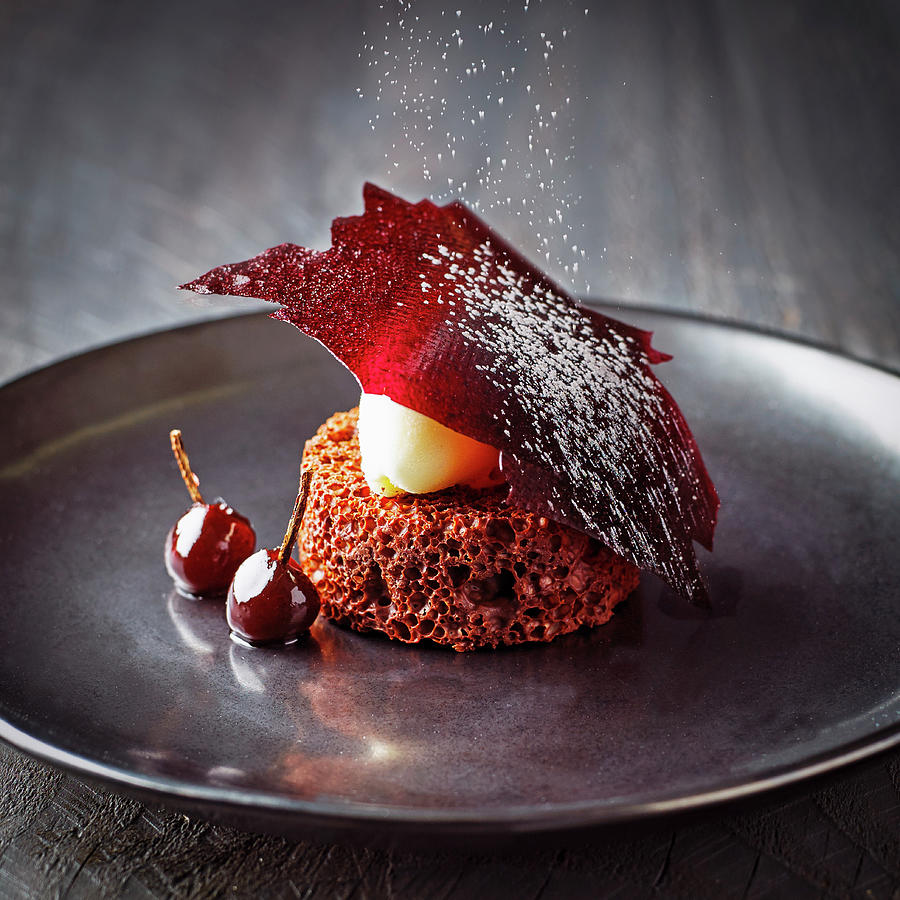 Valrhona Chocolate Dessert With Cherries And Icing Sugar Photograph by William Reavell
