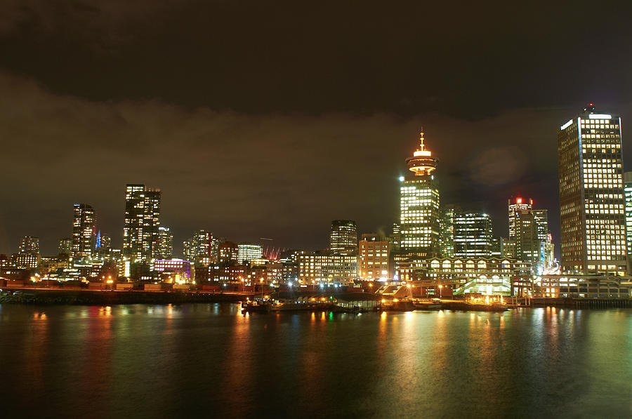Vancouver Skyline Lit Up At Night Photograph by Peter Muller