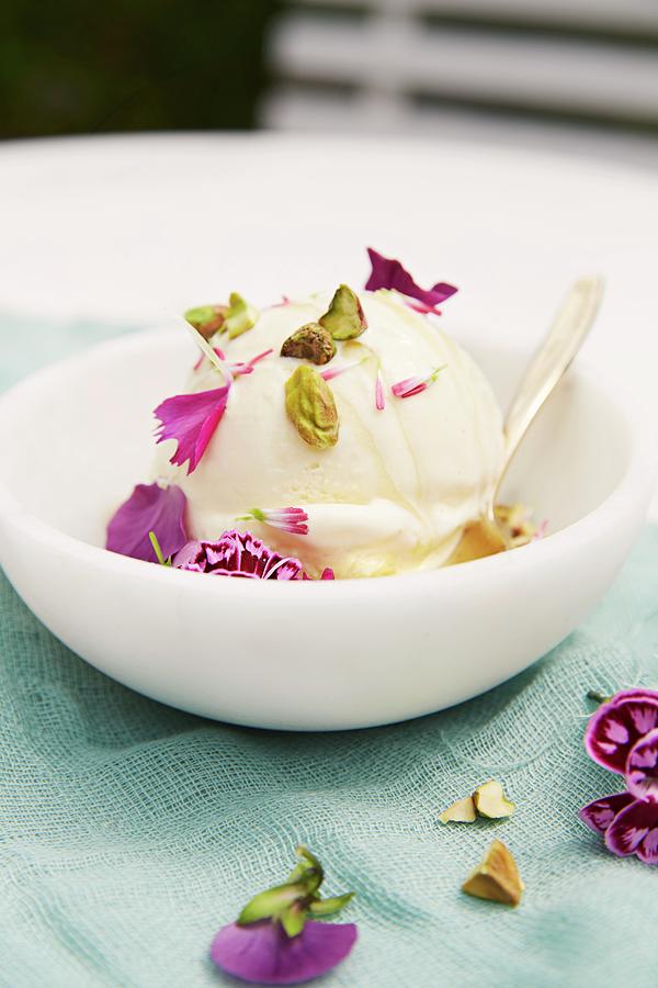 Vanilla And Lavender Ice Cream With Pistachios And Edible Flowers Photograph by Aina C. Hole