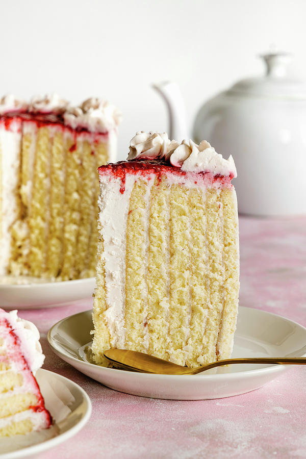 Vanilla And Raspberry Sponge Roll Cake Photograph by Alla Machutt