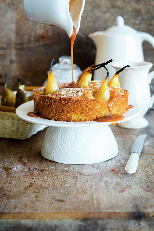 Vanilla Cake With Poached Pears, Flaked Almonds And Caramel Sauce Photograph by Irina Meliukh