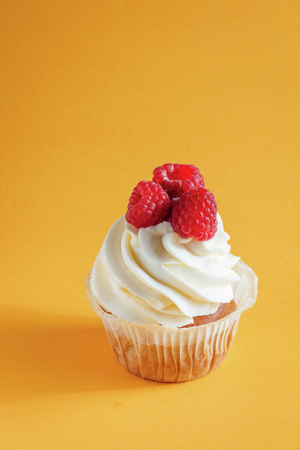 Vanilla Cupcake With Berries Photograph by Kate Prihodko