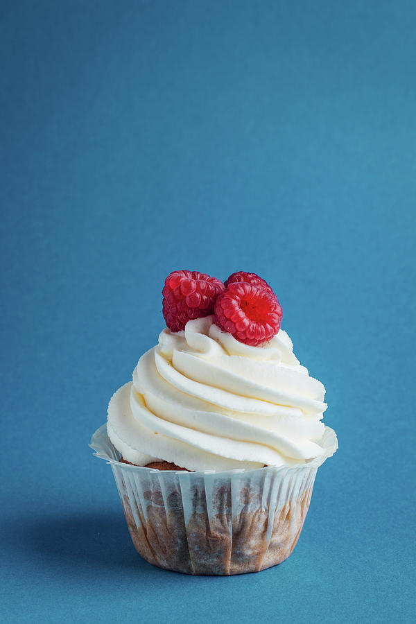 Vanilla Cupcake With Whipped Cream And Raspberries Photograph by Kate Prihodko