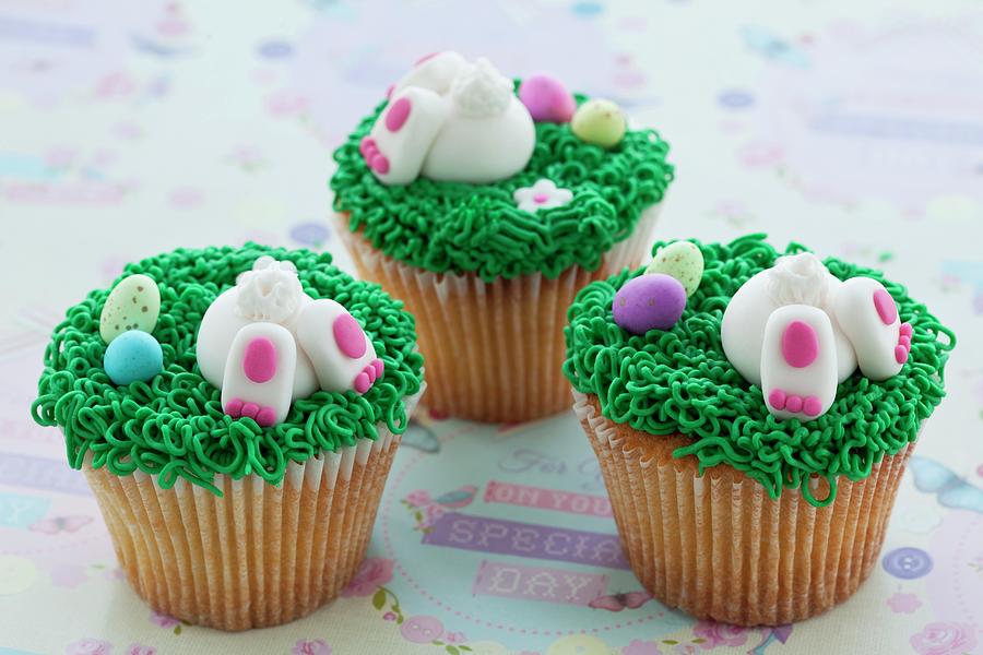 Vanilla Cupcakes With Buttercream And Sweet Easter-themed Decorations Photograph by Creative Photo Services