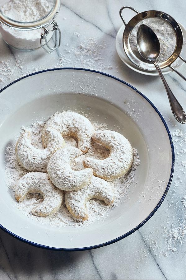 Vanilla Horns With Powdered Sugar On An Enamel Plate Photograph by Ulrike Emmert