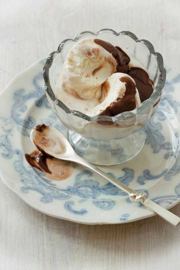 Vanilla Ice Cream With Hot Chocolate Sauce Photograph by Lingwood