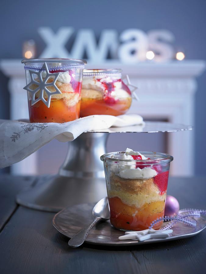 Vanilla Peaches In Jars With An Almond Sponge Topping, Raspberry Sauce And Whipped Cream christmas Photograph by Jan-peter Westermann