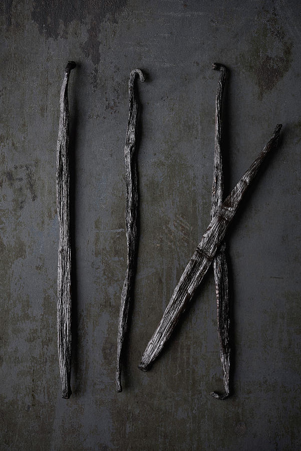 Vanilla Sticks On A Black Metal Plate Photograph by Sylvia Meyborg