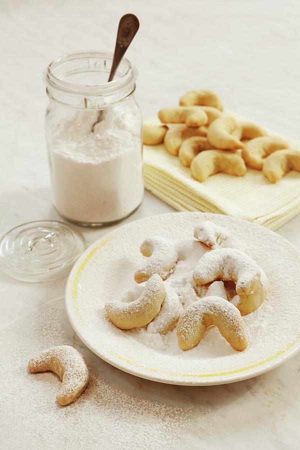 Vanillekipferl crescent-shaped Vanilla Biscuits Being Topped With Vanilla Sugar Photograph by Ulrika Ekblom