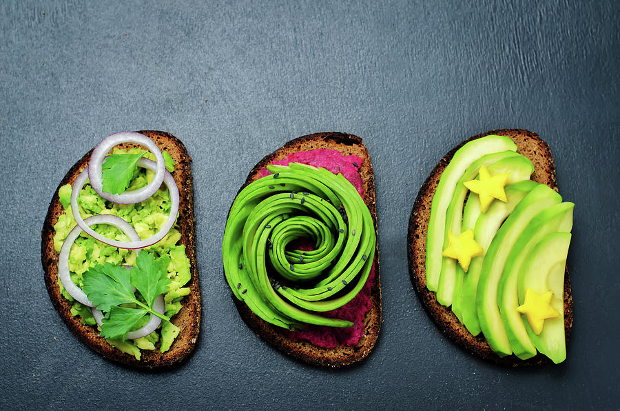 Variation Of Healthy Rye Breakfast Sandwiches With Avocado And Toppings. Toning Photograph by Natasha Arz