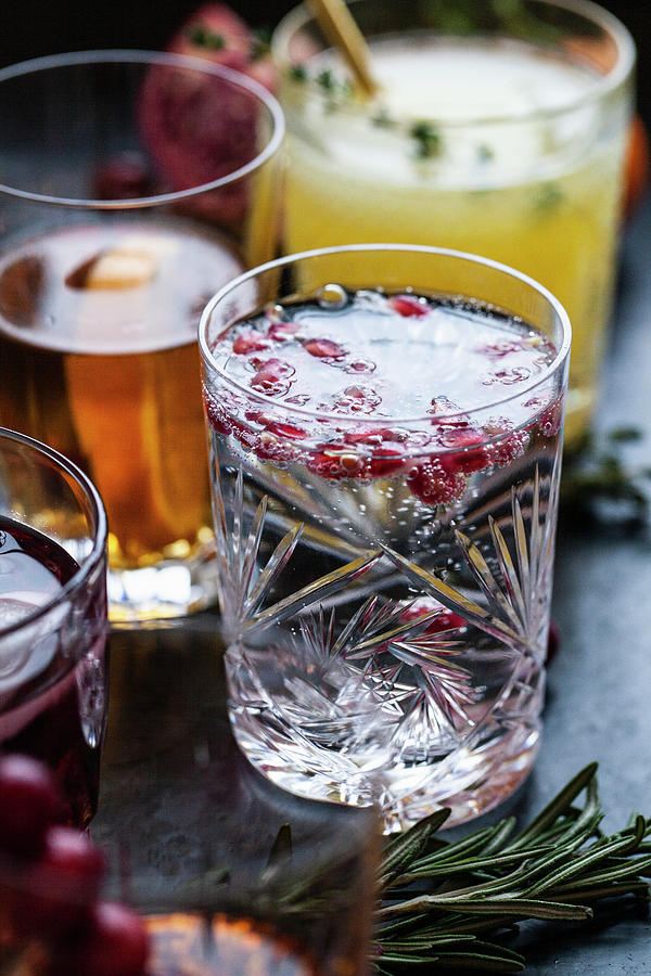 Various Alcoholic Drinks With Whisky, Bourbon, Vodka, Cranberry, Oranges, Pomegranates, Rosemary And Thyme Photograph by Ryla Campbell