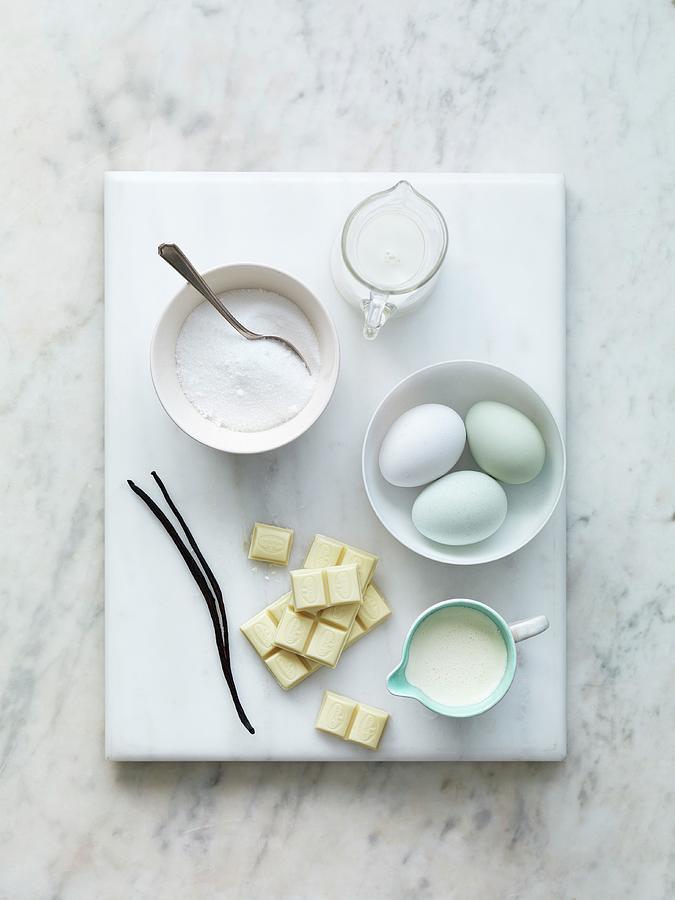 Various Baking Ingredients: Sugar, Milk, Eggs, Vanilla Pods, Flour And White Chocolate Photograph by Jonathan Gregson