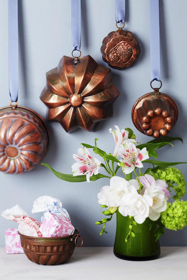 Various Cake Moulds Hung From Satin Ribbons Photograph by Franziska Taube