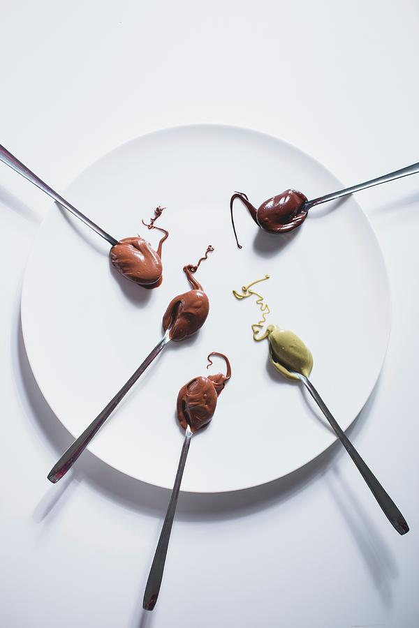 Various Chocolate Creams On A White Plate Photograph by Riccardobruni