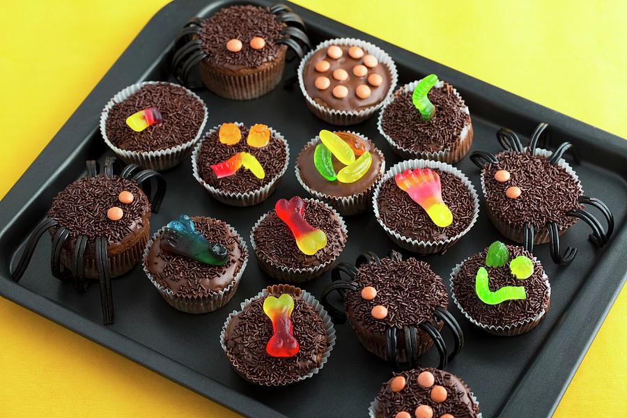 Various Chocolate Cupcakes Decorated With Sweets For Halloween Photograph by Lydie Besancon