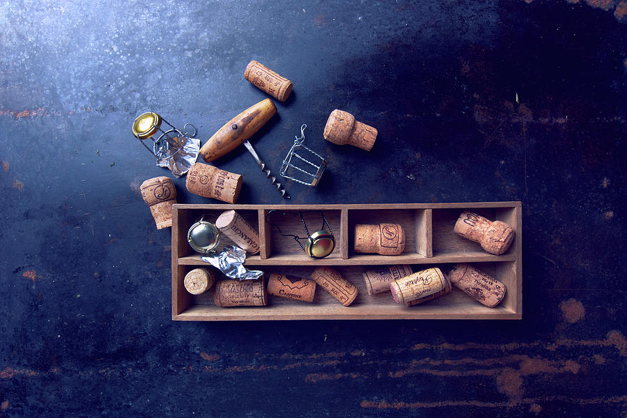 Various Corks In A Wooden Box And A Corkscrew Photograph by Christoph Maria Hnting