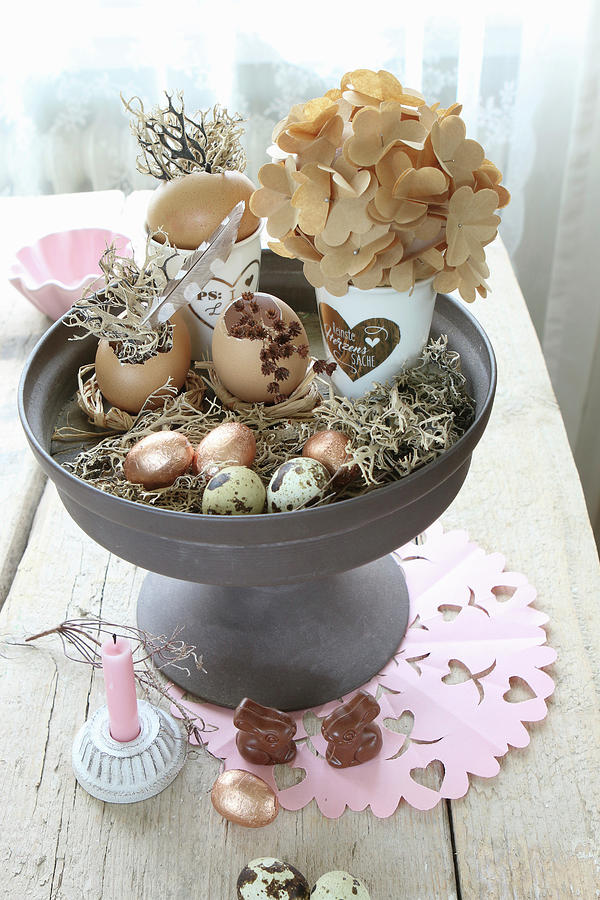 Various Easter Eggs And Quail Eggs On Cake Stand And Chocolate Bunnies On Table Photograph by Regina Hippel