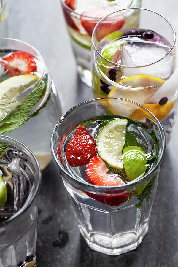Various Glasses Of Water Filled With Fruit, Mint And Ginger Photograph by Ryla Campbell