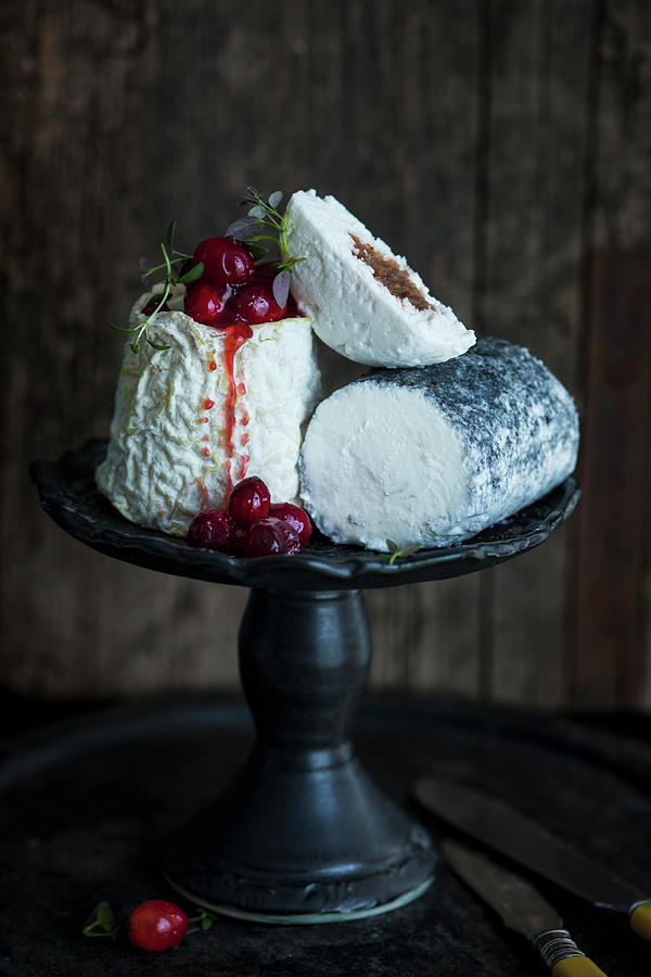 Various Goats Cheeses On A Cake Stand Photograph by Katrin Winner