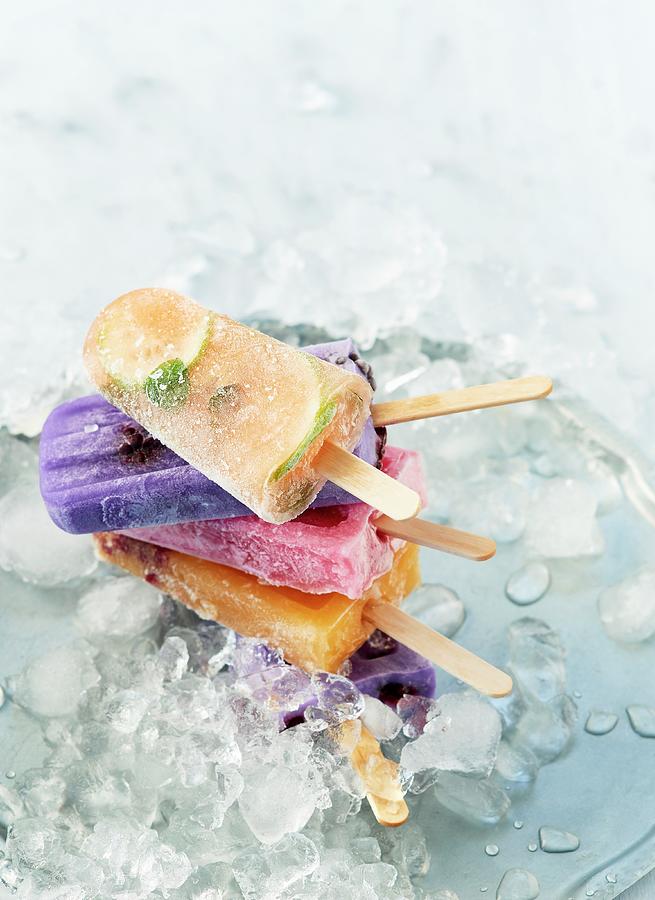 Various Ice Lollies On Crushed Ice Photograph by Stefan Schulte-ladbeck