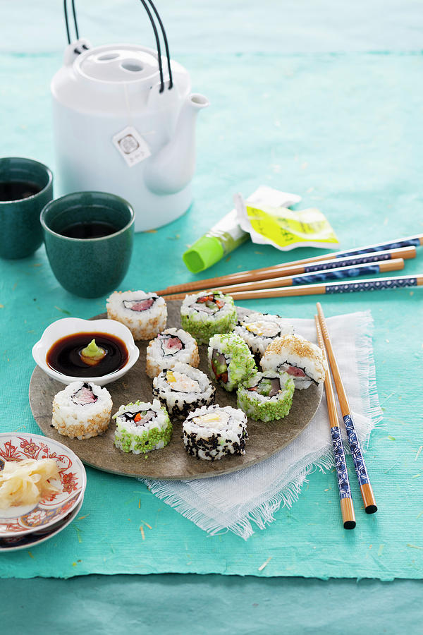 Various Inside-out Sushi Rolls With Soy Sauce, Ginger And Wasabi Photograph by Peter Kooijman