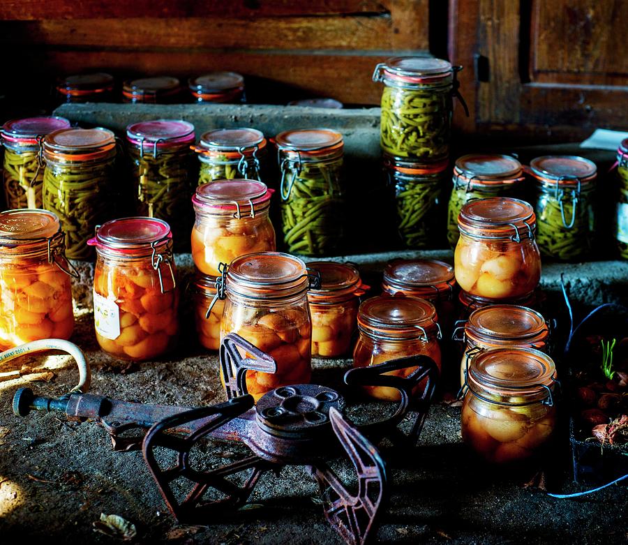 Various Jars Of Pickles In A Rustic Atmosphere Photograph by Roger Stowell