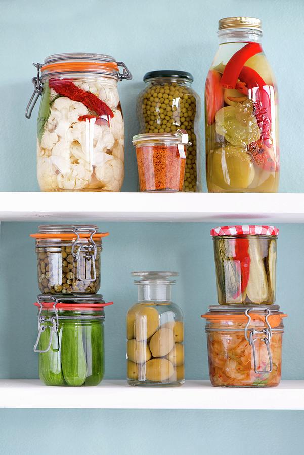 Various Jars Of Preserved Vegetables On A Shelf Photograph by Jamie Watson