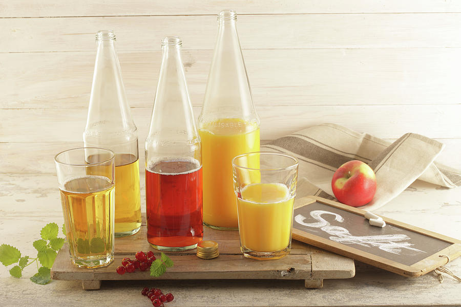 Various Juices apple, Currant, Orange Photograph by Uwe Bender
