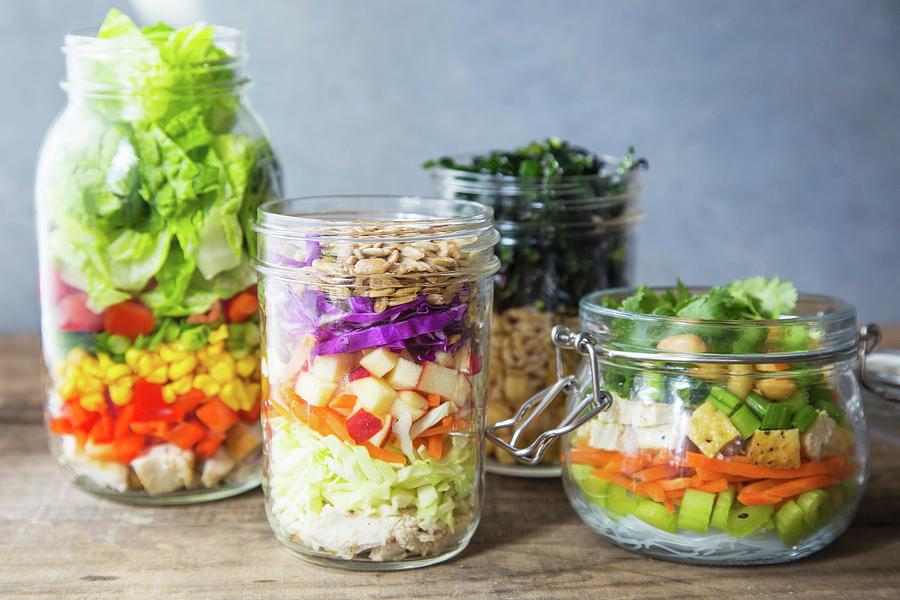 Various Layered Salads In Glass Jars Photograph by Lori Rice