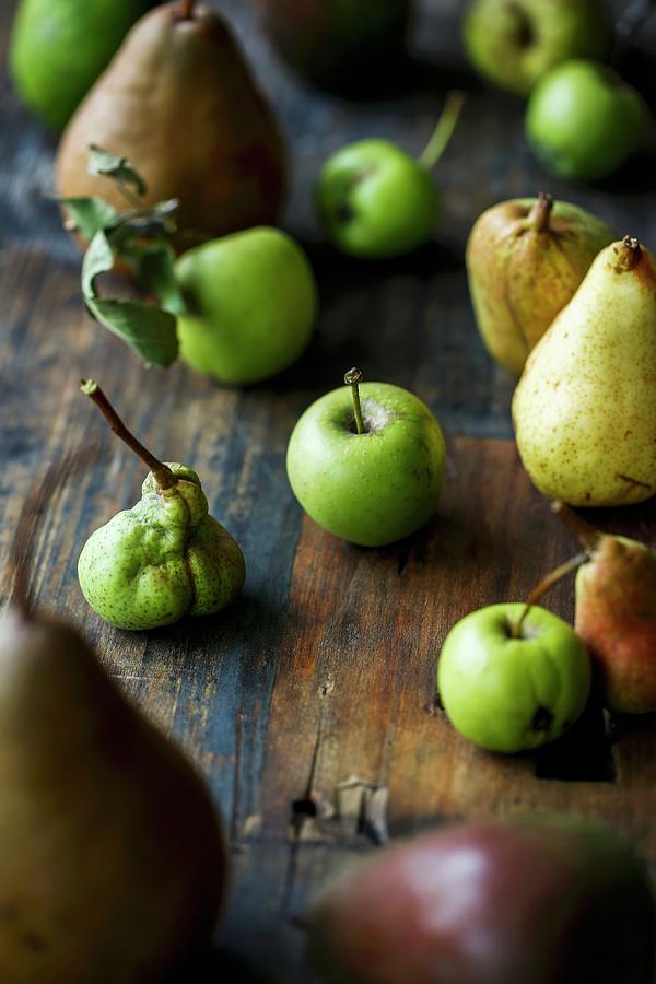 Various Organic Apples And Pears On A Wooden Surface Photograph by Sandra Krimshandl-tauscher