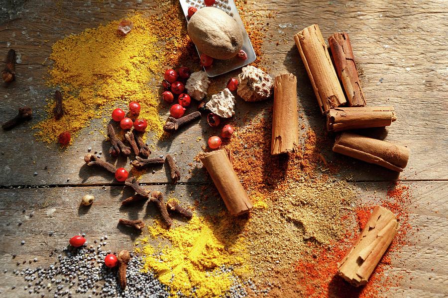 Various Oriental Spices On A Wooden Table Photograph by Viola Cajo