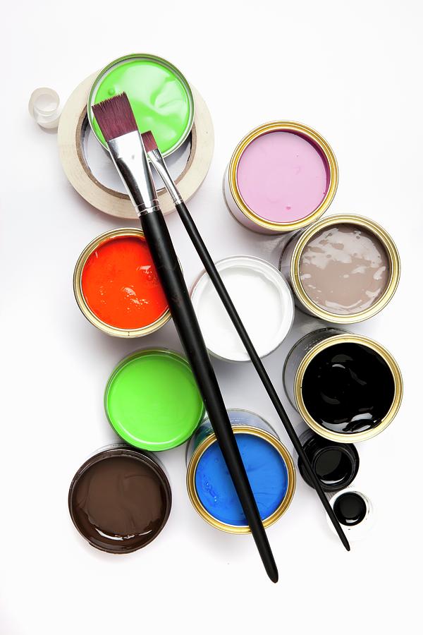 Various Pots Of Paint, Paintbrushes And Masking Tape Seen From Above Photograph by Sabine Lscher