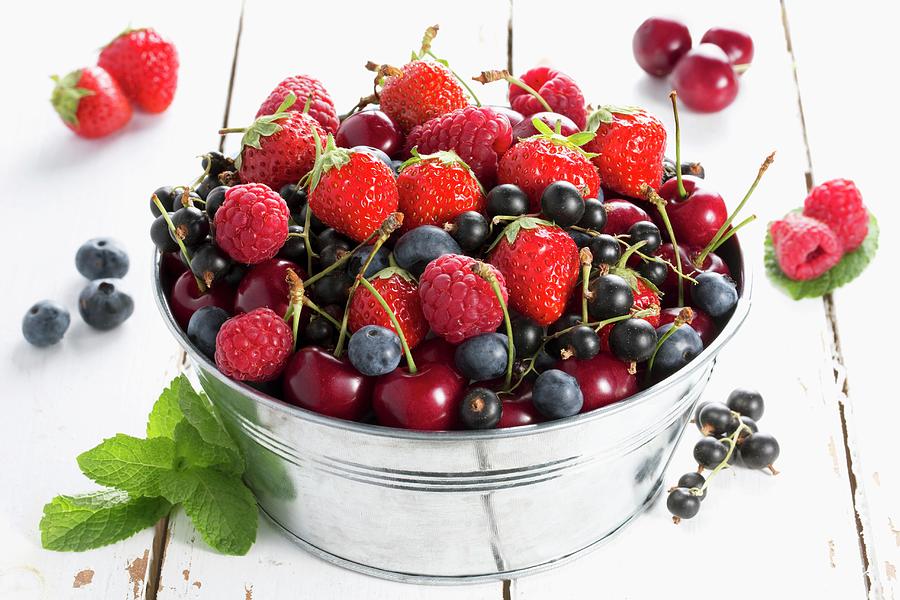 Various Red Fruits In A Metal Bucket Photograph by Lydie Besancon
