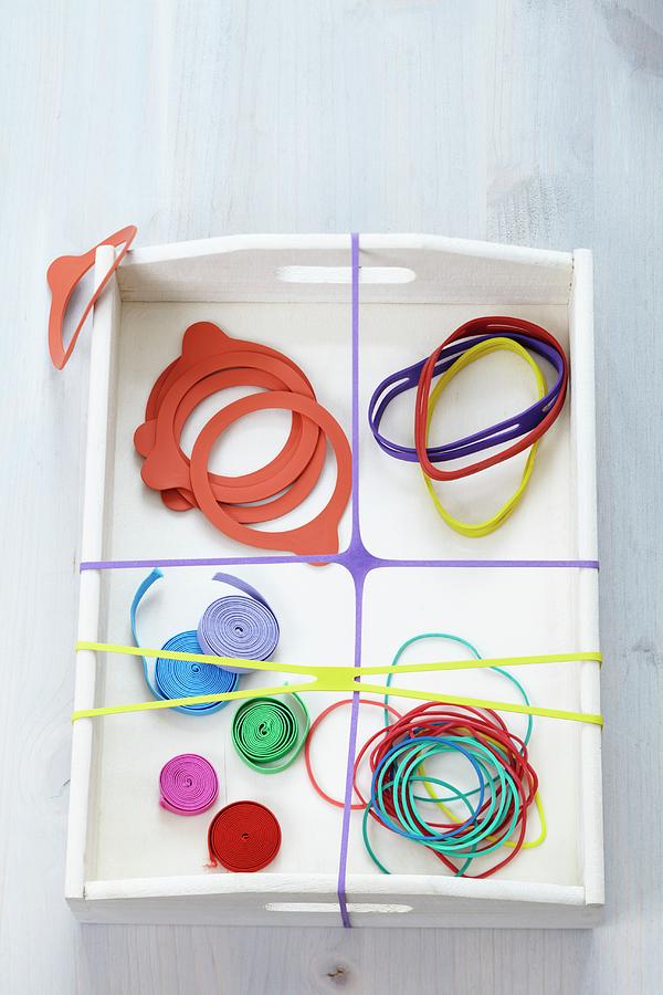 Various Rubber Bands On Tray Photograph by Franziska Taube