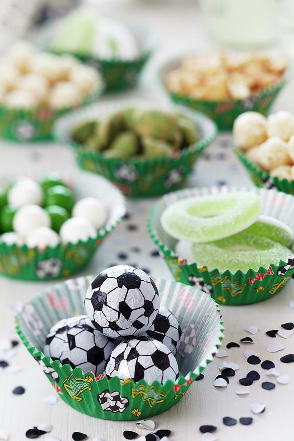 Various Snacks Arranged In Muffin Cases With Football Decorations Photograph by Franziska Taube