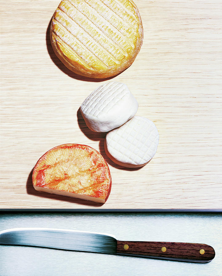 Various Soft Cheeses On A Board With Knife, Food Photograph by R. Striegl