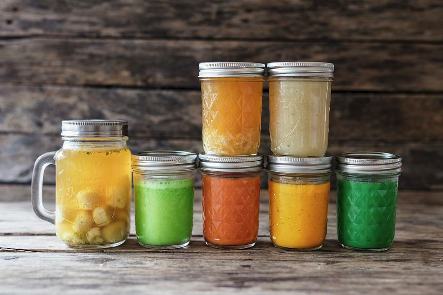 Various Soups In Screw-top Jars Photograph by Jan Wischnewski