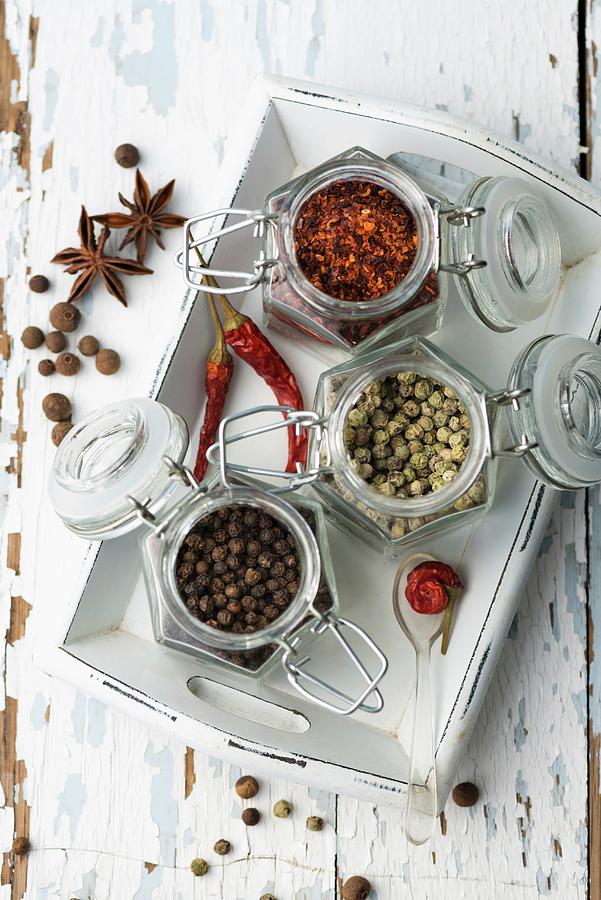 Various Spices In Storage Jars On A Tray Photograph by Komar