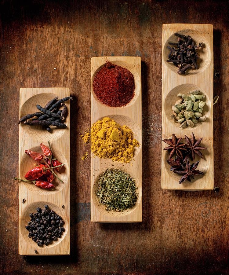 Various Spices In Wooden Dishes seen From Above Photograph by Natasha Breen