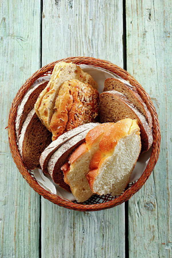 Various Types Of Bread In Bread Basket Photograph by Petr Gross