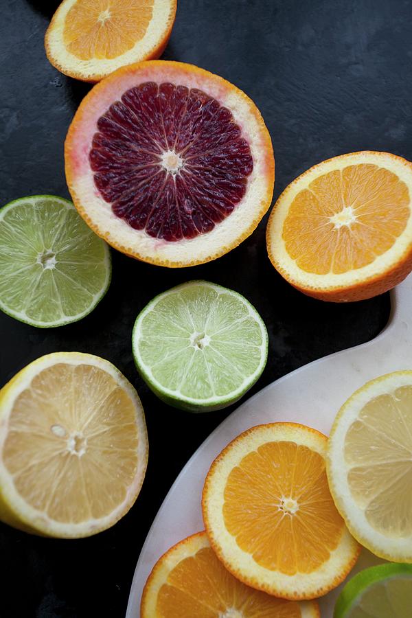 Various Types Of Citrus Fruits, Sliced And Halved seen Above Photograph ...