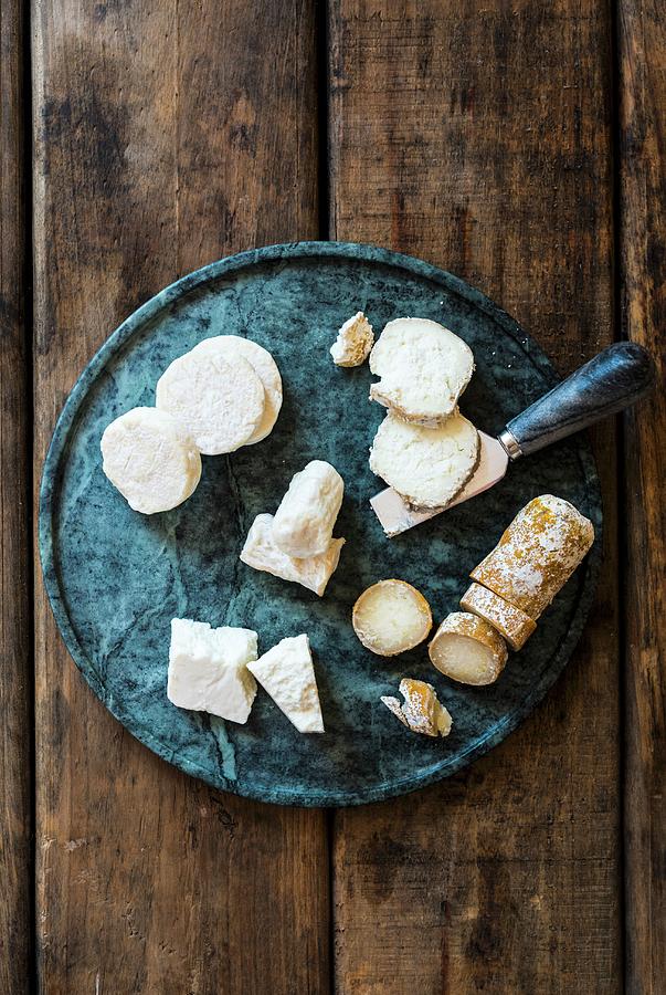 Various Types Of Goats Cheese On A Serving Platter seen From Above Photograph by Hein Van Tonder
