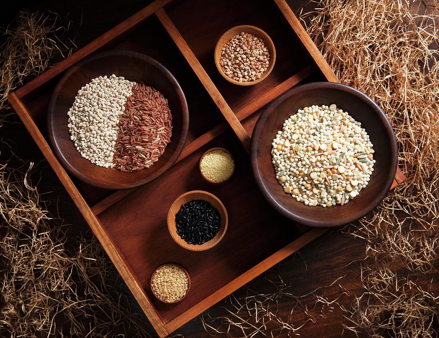 Various Types Of Grains In Wooden Bowls In A Rustic Atmosphere Photograph by Katharine Pollak
