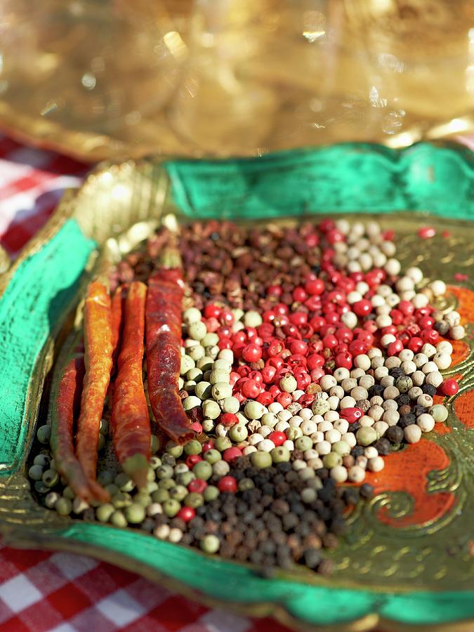 Various Types Of Peppercorns And Chilli Peppers On A Tray For A Barbecue Party Photograph by Hannah Kompanik