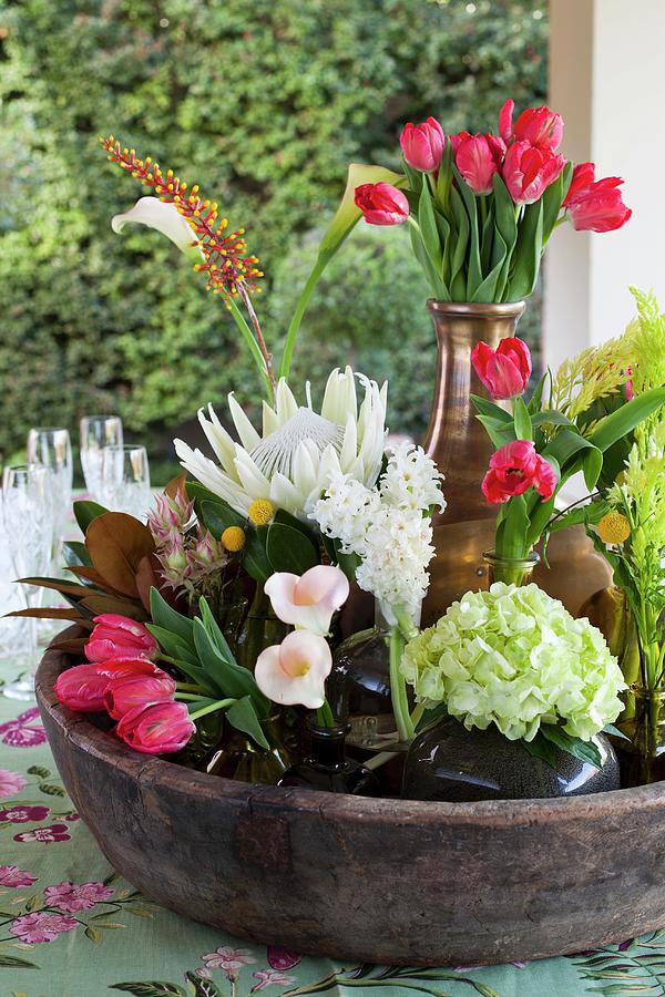 Various Vases Of King Proteas, Arum Lilies, Red Tulips, Hyacinths, Bromeliads And Celosia In Large Bowl Photograph by Great Stock!