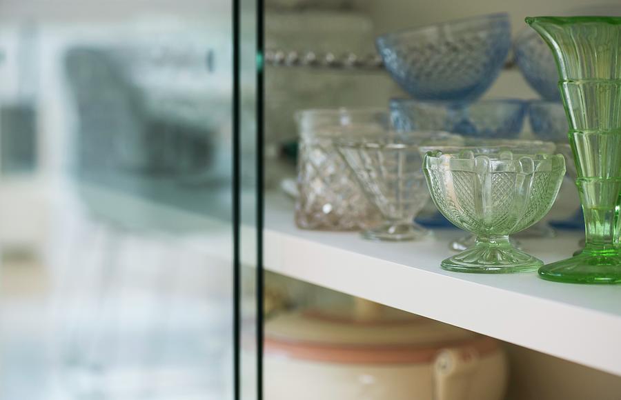 Various Vintage Glass Vessels In Glass-fronted Cabinet Photograph by Holly Pickering