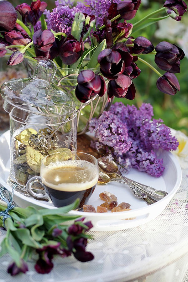 Vase Of Black Tulips, Lilac Flowers And Cup Of Espresso On Tray Photograph by Angelica Linnhoff