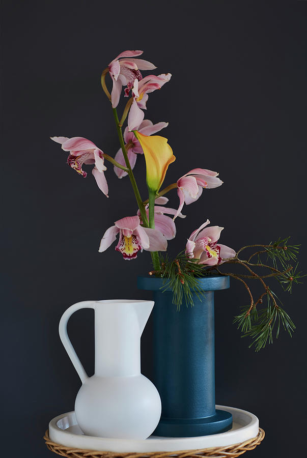 Vase Of Boat Orchids, Calla Lily And Pine Branch Photograph by Nicoline Olsen