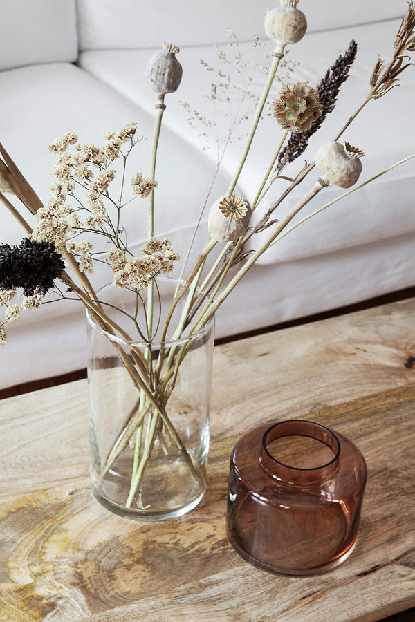 Vase Of Dried Flowers On Coffee Table With Wooden Top Photograph by Hej.hem Interior