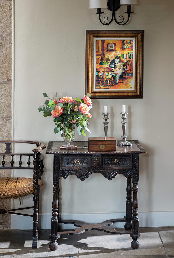 Vase Of Roses, Wooden Box And Candles On Antique Console Table With Carved Ornamentation Photograph by Brian Harrison